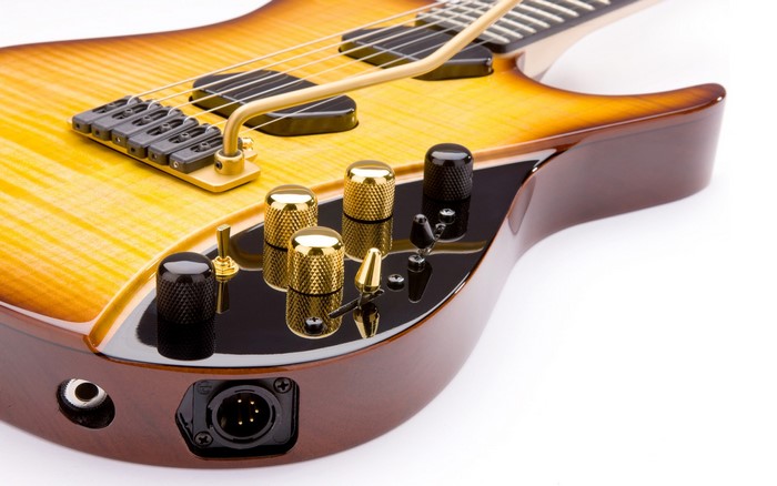 Close-up of a sunburst electric guitar controls