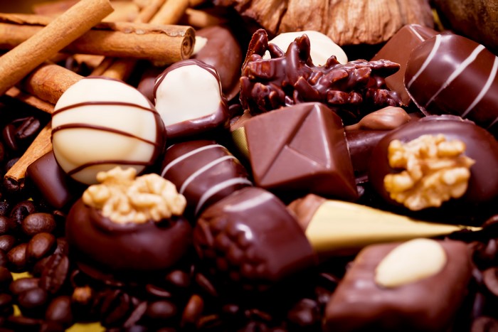 Assortment of chocolates, cinnamon sticks, and coffee beans