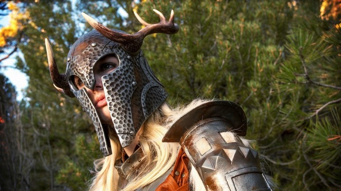 Woman in Skyrim horned helmet and armor