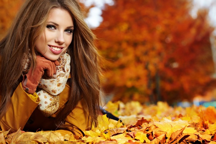 Woman in Autumn Foliage