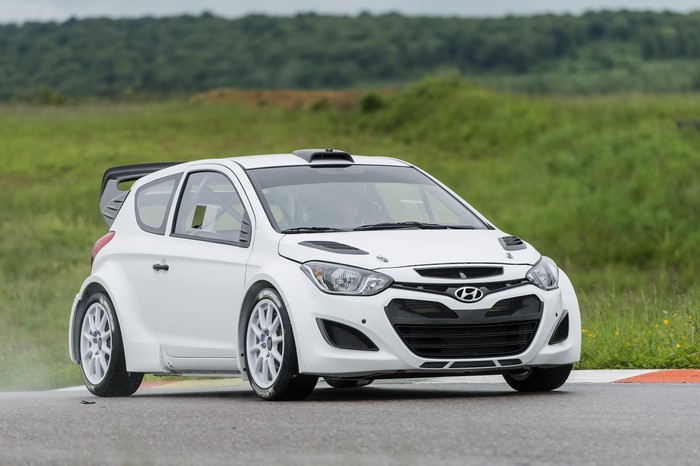 White 2013 Hyundai i20 WRC car on a track
