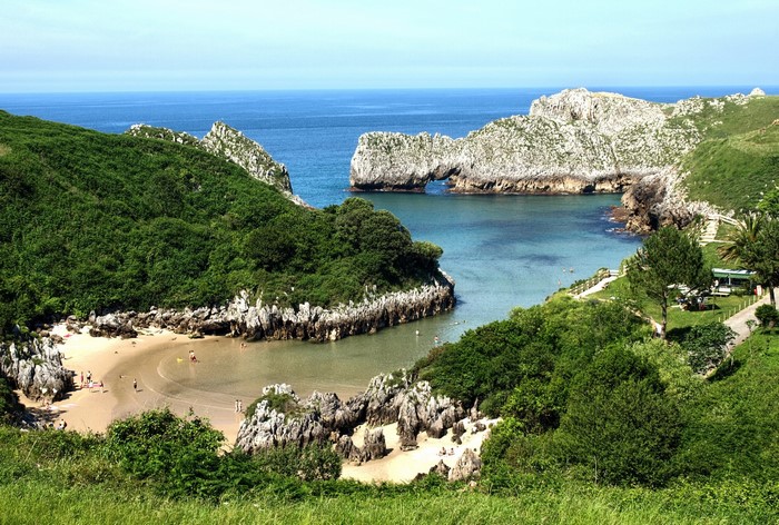 Coastal cove with rocky arch in Cantabria, Spain
