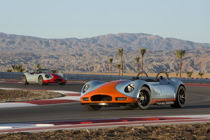 Two 2012 Lucra LC470 sports cars on a race track