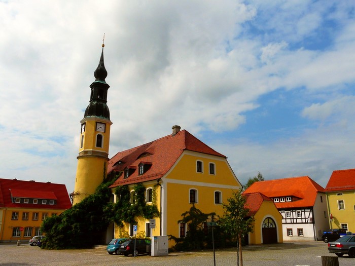 Yellow church tower and buildings in Germany