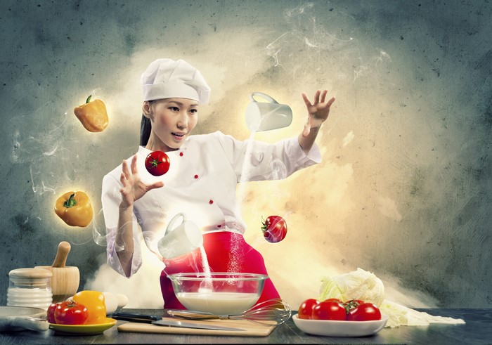 Asian chef conjuring food with magic
