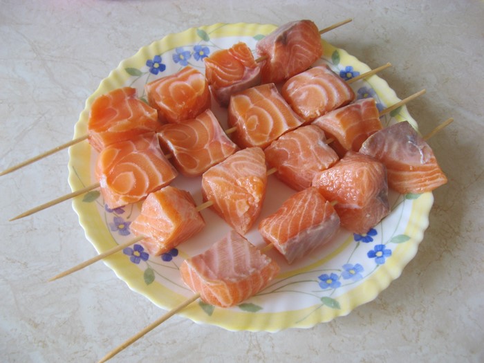 Salmon skewers on a plate