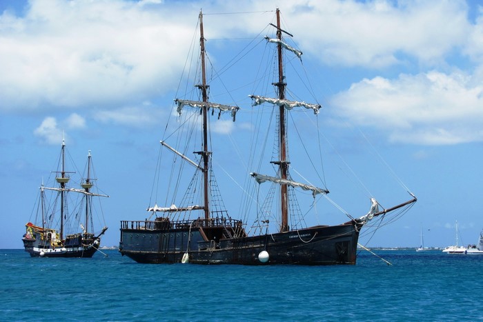 Two pirate ships sailing on the ocean