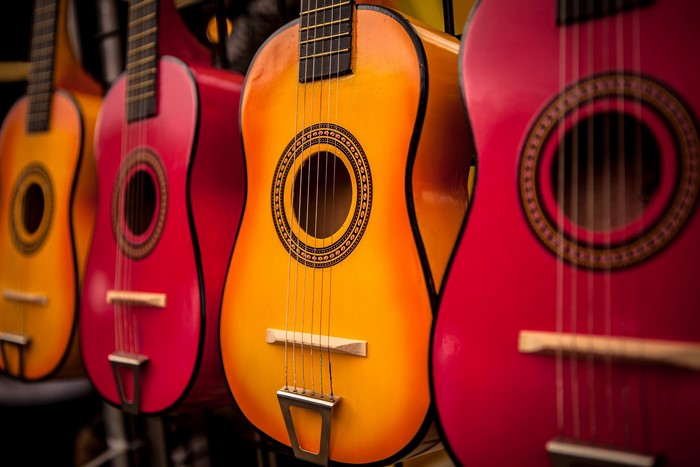Close-up of colorful acoustic guitars