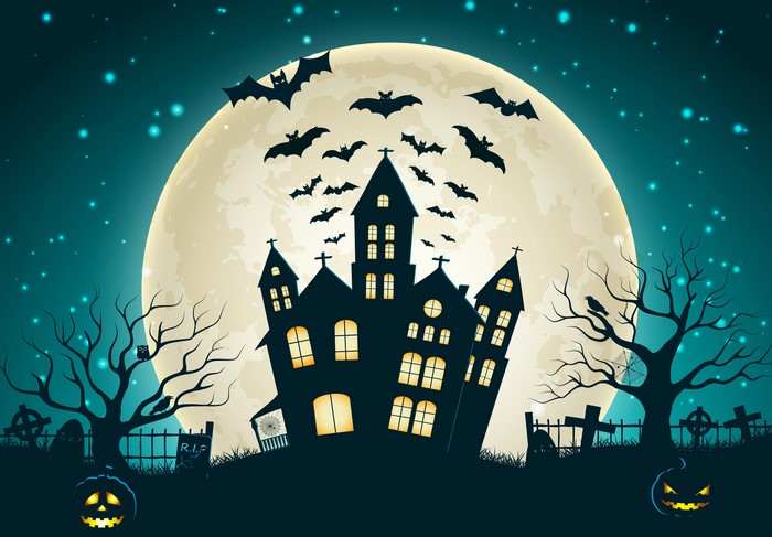 Halloween haunted house with bats and full moon