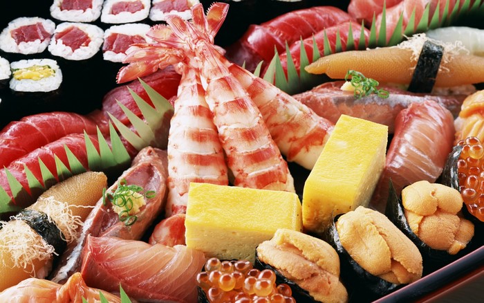 Assortment of sushi and sashimi with shrimp
