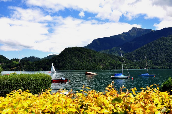 Boats on a lake with mountains in Austria