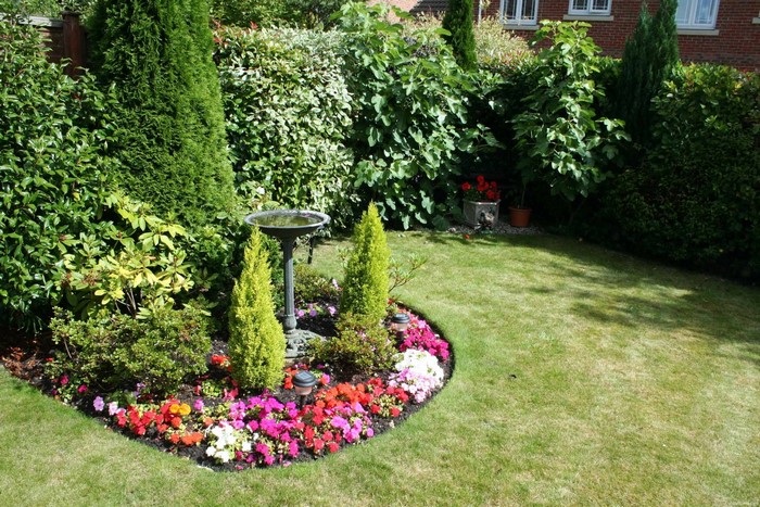 Garden with flower bed and bird bath