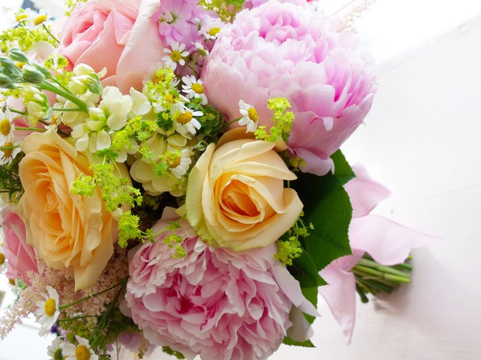 Pink and yellow roses and peonies bouquet