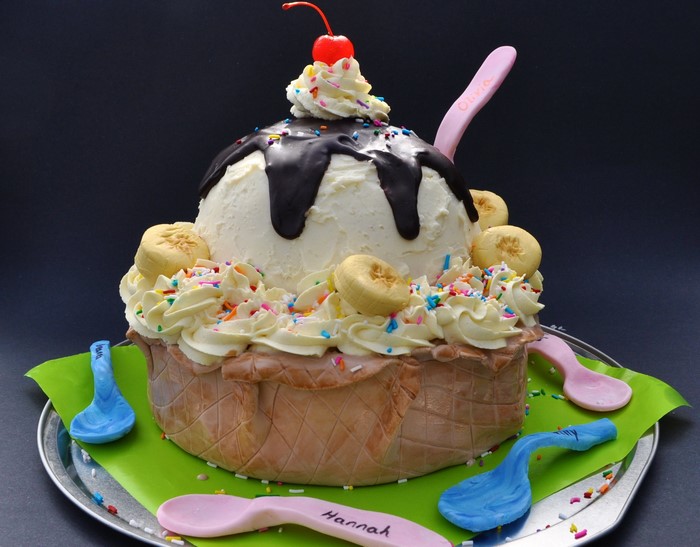 Ice cream sundae cake with cherry and sprinkles