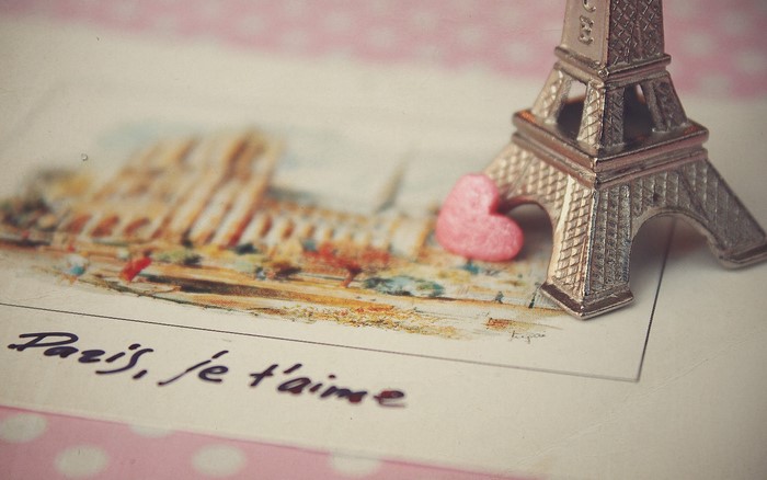 Eiffel Tower souvenir with pink heart on postcard