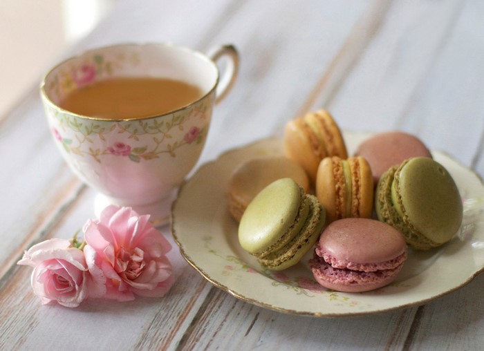Tea cup and macarons on a plate