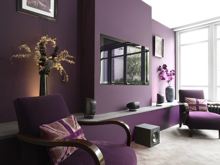 Purple living room with armchairs and TV