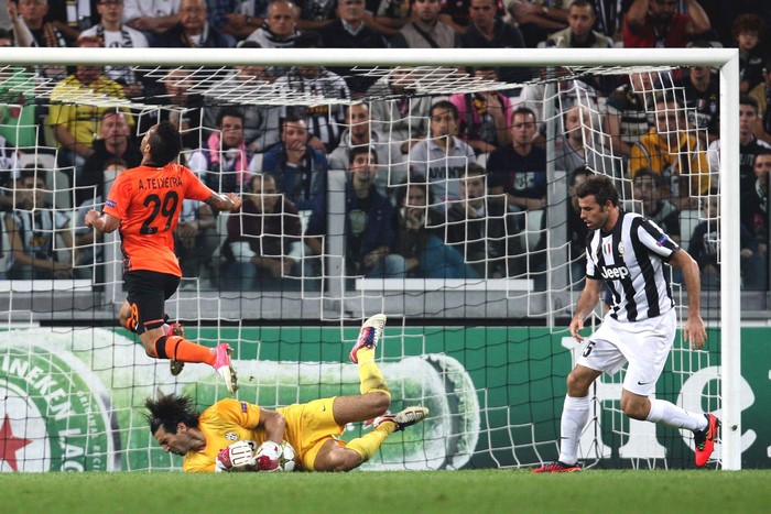 Football player A. Teixeira of Shakhtar Donetsk scores a goal against Juventus