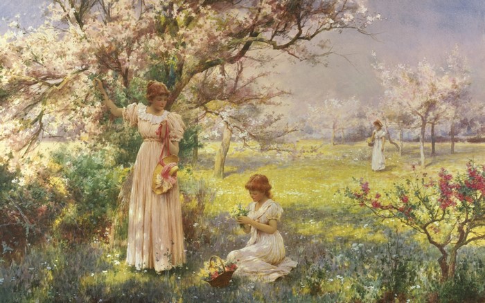 Women in a blooming garden picking flowers