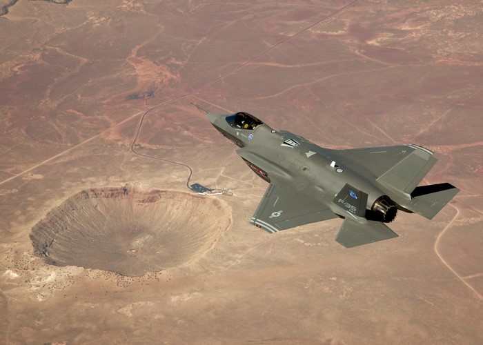 F-35A fighter jet flying over Meteor Crater