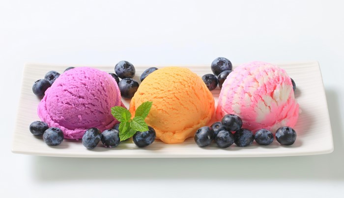 Three scoops of ice cream with blueberries
