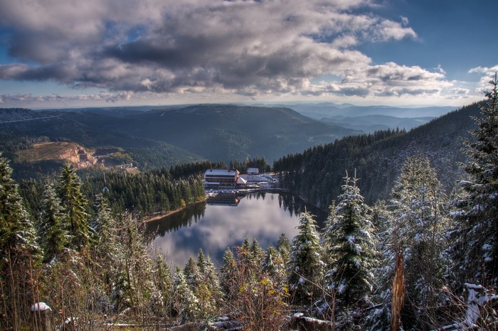 Lake and forest in Seebach, Germany with mountains and clouds