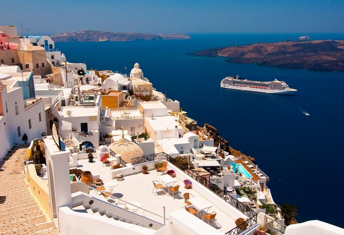 Santorini, Greece: White Houses Overlooking the Aegean Sea with Cruise Ship
