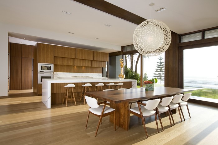 Modern kitchen and dining area with ocean view