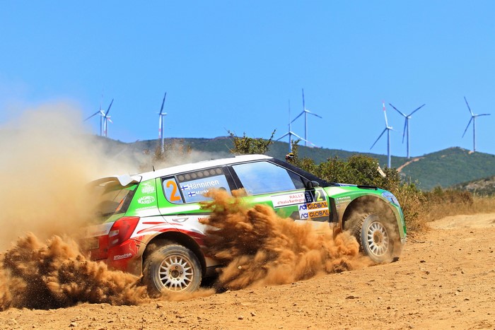 Skoda Fabia rally car kicking up sand