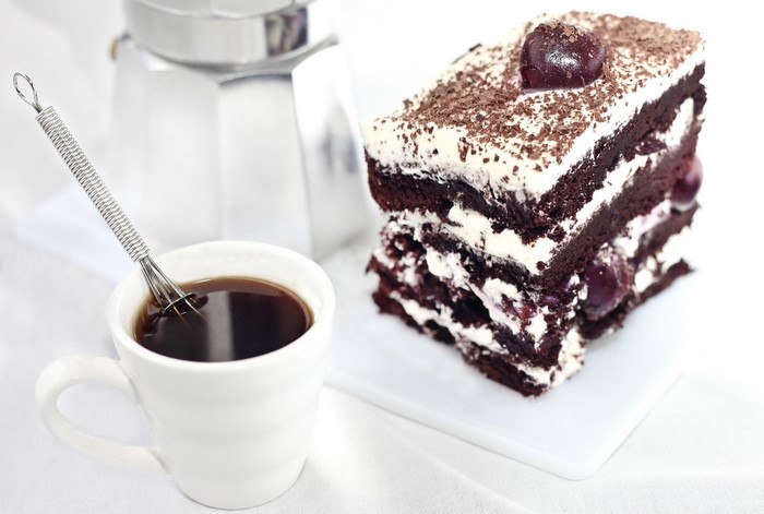 Black Forest cake slice with coffee and moka pot