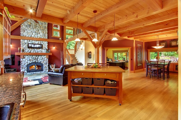 Rustic living room with stone fireplace and wooden beams