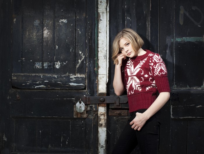 Chloe Grace Moretz in a Fair Isle Sweater by a Door