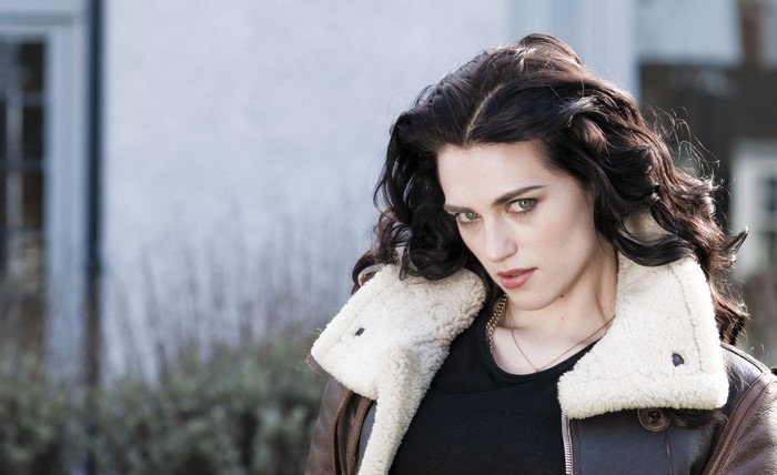 Katie McGrath looking over her shoulder