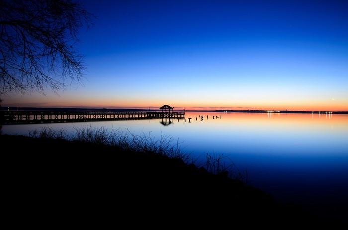 Pier and gazebo over water at dusk in Virginia