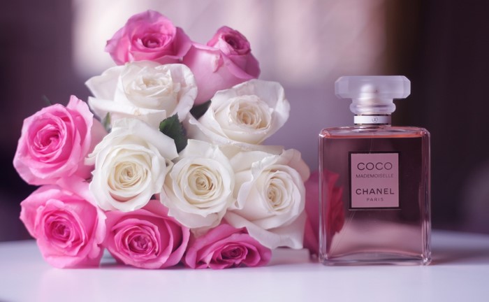 Chanel Coco Mademoiselle perfume bottle with pink and white roses