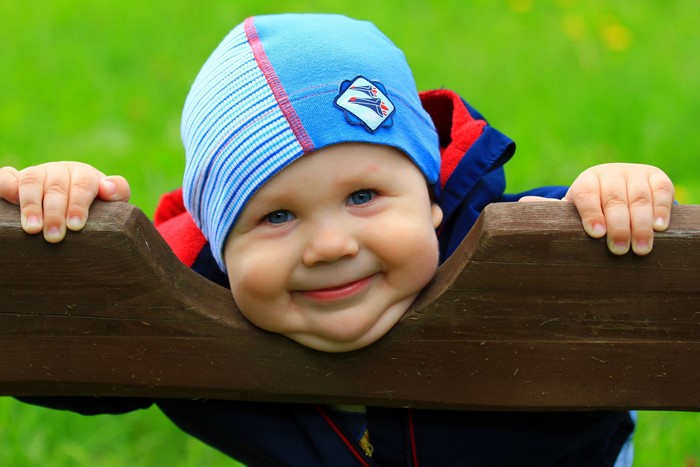 Baby wearing a blue winter hat