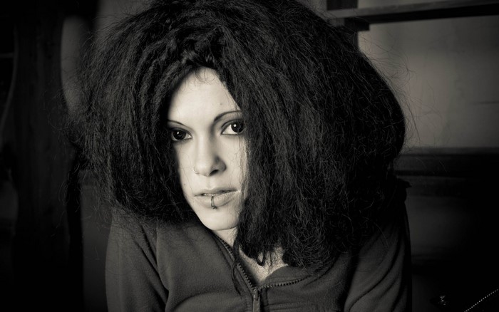 Woman with dreadlocks and piercings
