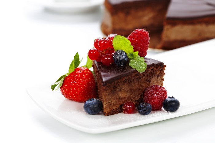 Chocolate cake with fresh berries and mint