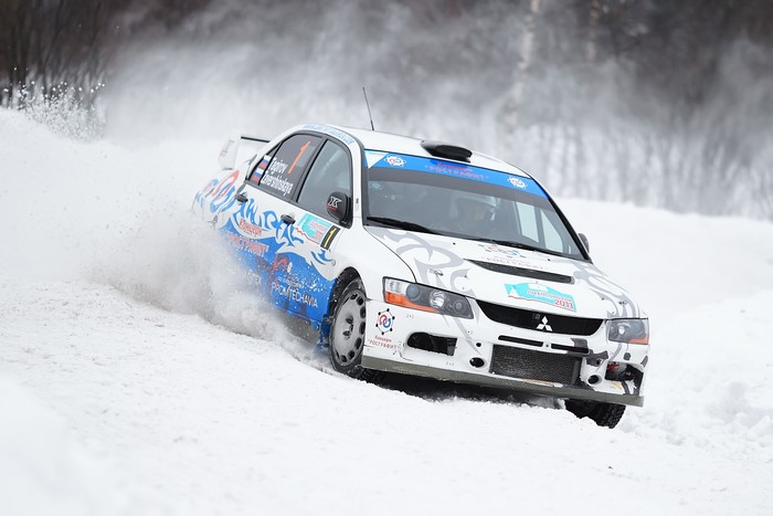 Mitsubishi Lancer Evolution rally car racing on snow