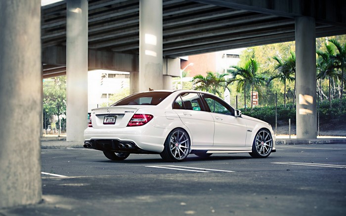 White Mercedes-Benz C63 AMG Sedan parked