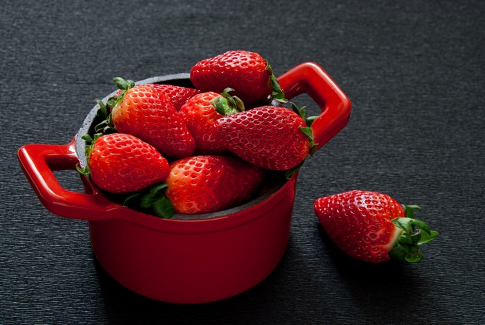 Strawberries in a red pot