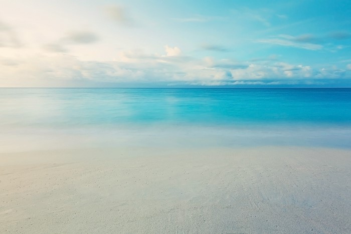 Beach and Ocean Horizon with Clouds