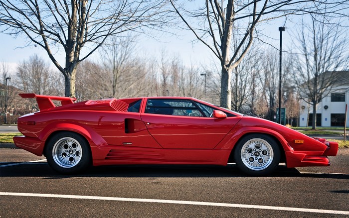 Red Lamborghini Countach parked on asphalt