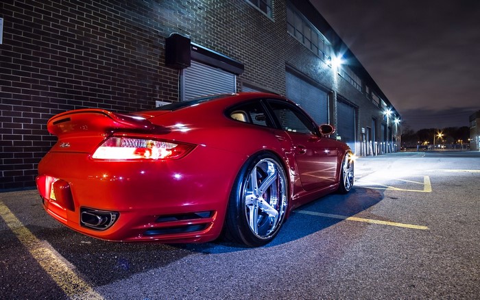 Red Porsche 911 Turbo from behind at night