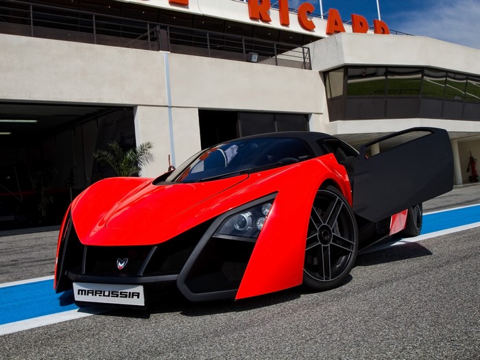 Red Marussia B2 supercar with open door