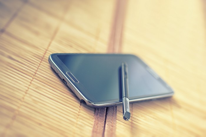 Samsung Galaxy Note 2 with S Pen on bamboo mat