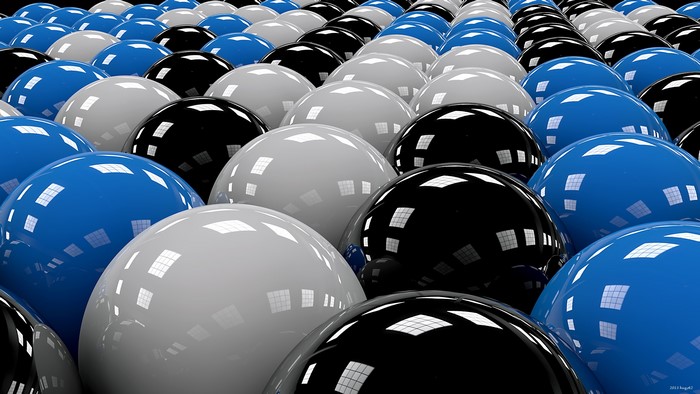 Rows of blue, black, and white spheres