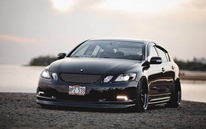 Black Lexus GS 350 parked by the water