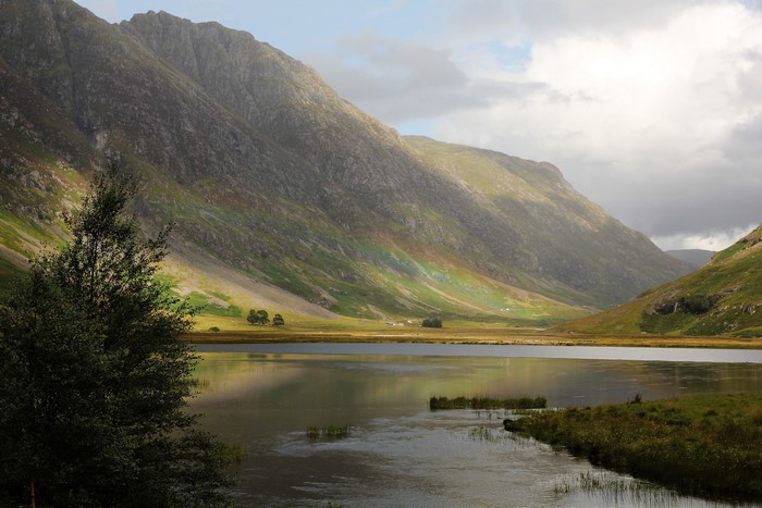 Valley with lake and mountains in Scotland