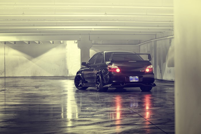 Black Subaru Impreza WRX STI in parking garage